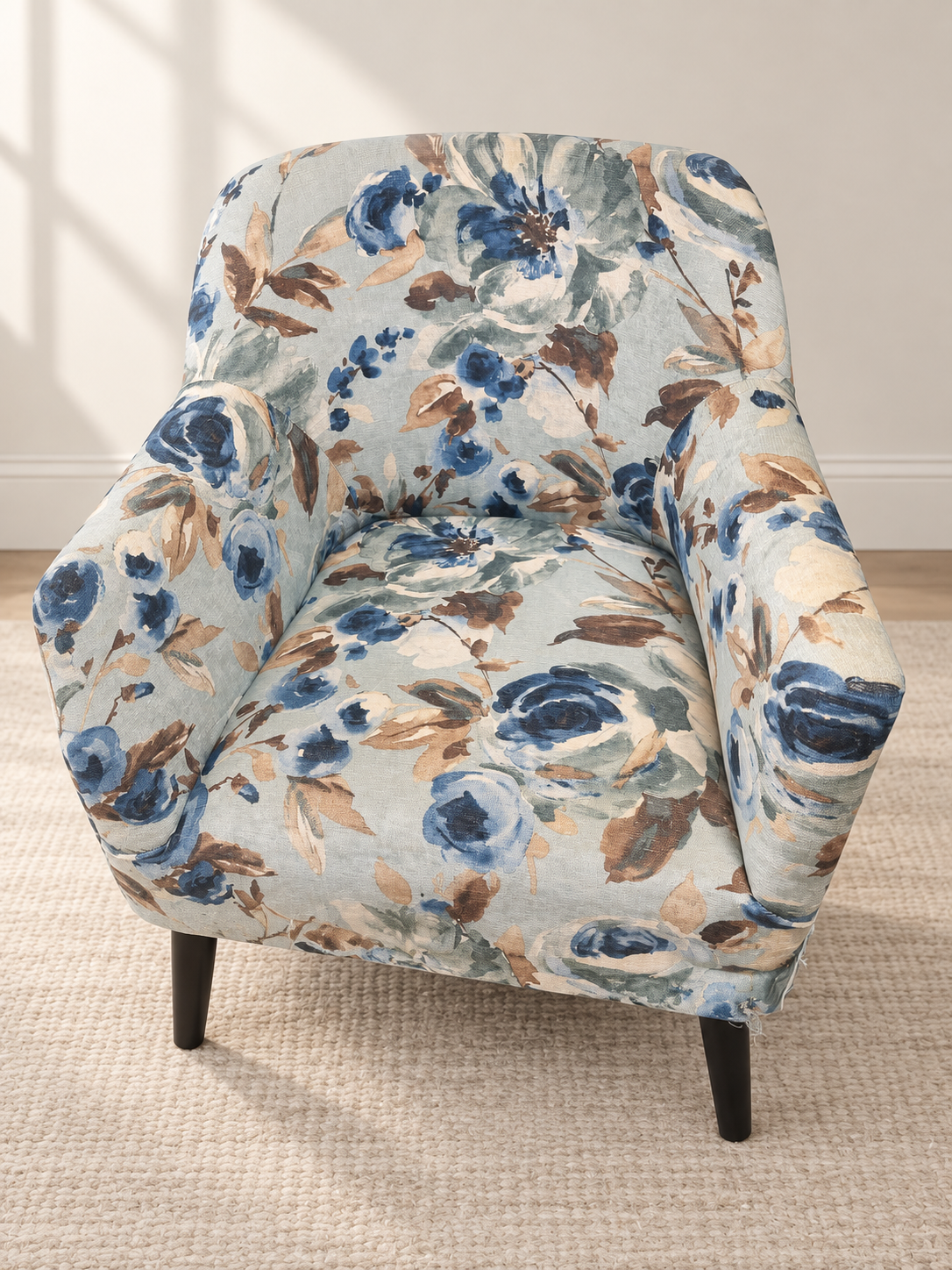 AI-retouched project photo of an accent chair in blue, green, and tan floral fabric